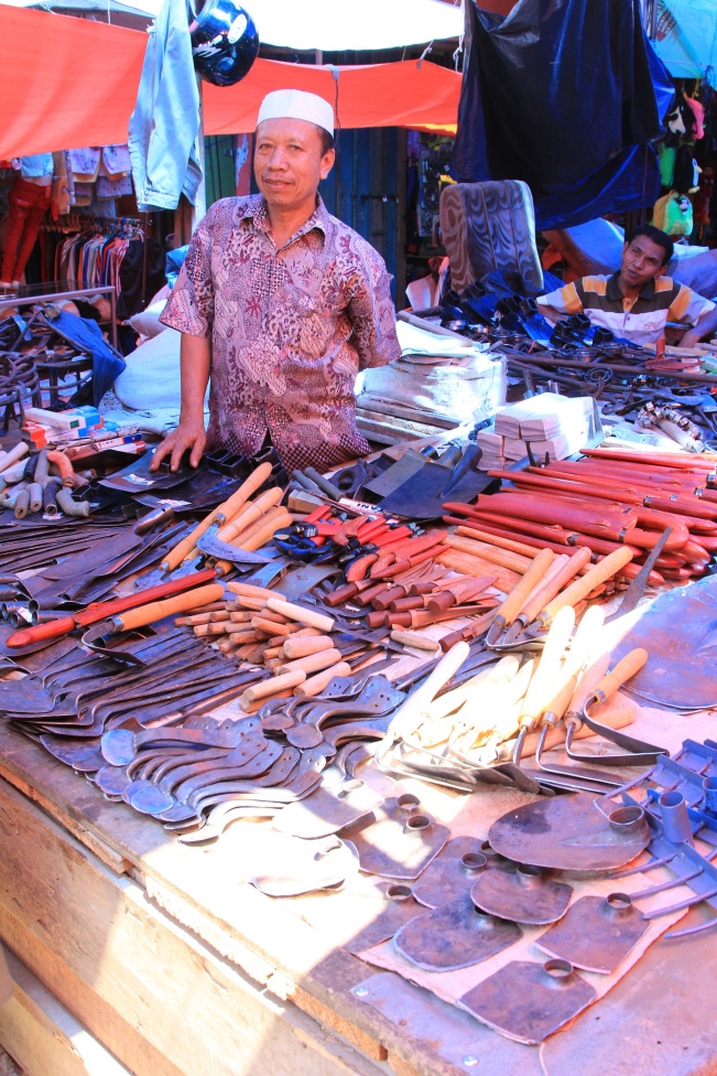 Blacksmith at the market in Sungai Penuh